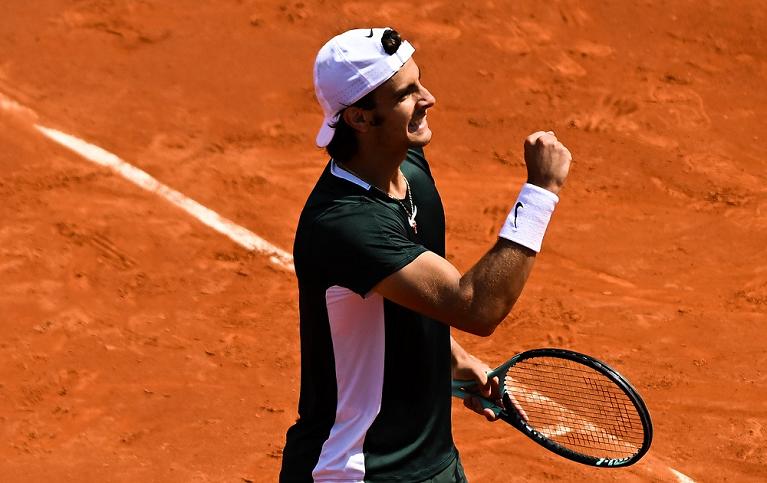 Lorenzo Musetti esulta (foto Getty Images)
